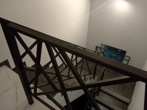 a view from the top of a room with a metal railing at 39 Apart Hotel in Lviv