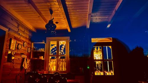 a room with a door and a window at night at Club Thermal Village Cegled in Cegléd