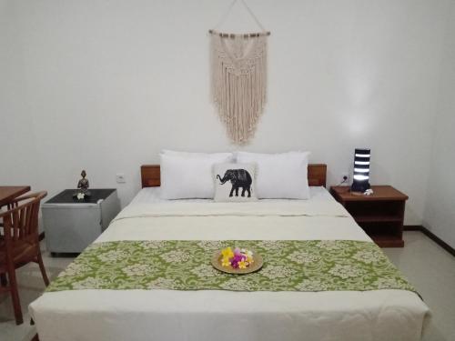 Postel nebo postele na pokoji v ubytování D'pandawa guest house