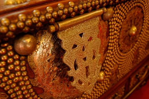 a close up of a gold object with beads on it at Zanzibar Palace Hotel in Zanzibar City