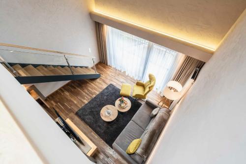 an overhead view of a living room with a couch at Hotel Restaurant Waldsägmühle in Pfalzgrafenweiler