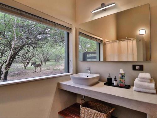 Kylpyhuone majoituspaikassa Kruger Nights