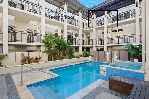 a swimming pool in front of a building at Spacious 3 bedroom apartment opposite surf club in Kingscliff