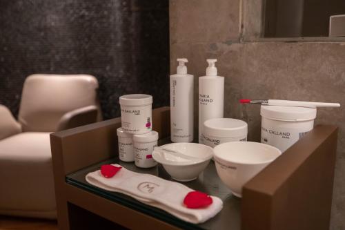 a table with bottles and bowls on top of it at Gray Boutique Hotel Casablanca in Casablanca