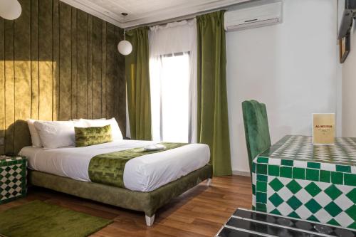 Ένα ή περισσότερα κρεβάτια σε δωμάτιο στο Hotel Majestic
