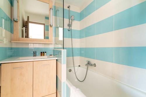 a bathroom with a tub and a shower at Sunny Home Costa Plana-Monaco -Cap D'Ail in Cap d'Ail