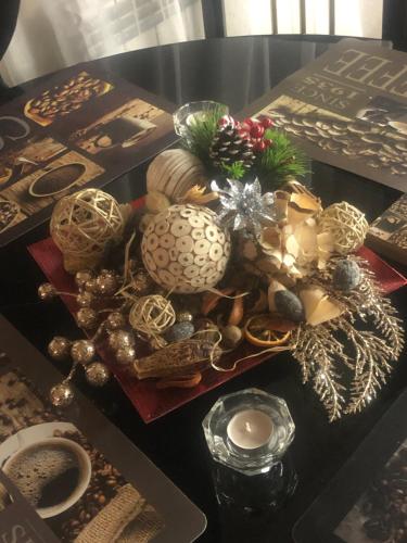 a table with christmas decorations on top of it at Sunshine villa Dzhigurovo in Sandanski