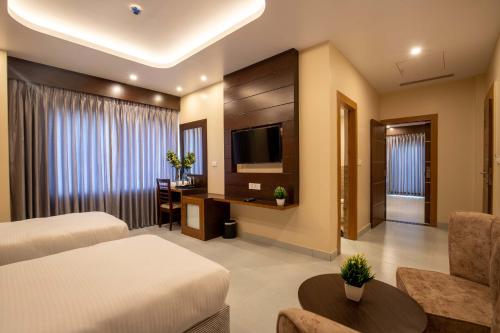 Postel nebo postele na pokoji v ubytování Hotel Palm International
