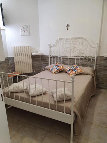 a white bed with pillows on it in a room at Casa de Diego in Francavilla al Mare