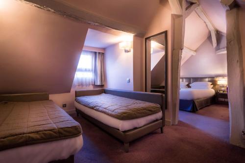 מיטה או מיטות בחדר ב-Hotel Massena