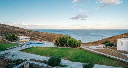 an aerial view of a house and the ocean at Cape Napos in Faros