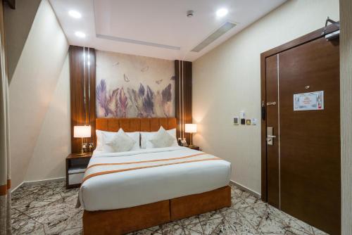 Katil atau katil-katil dalam bilik di Tulip Plaza Hotel