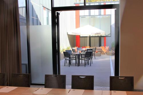 a view of a dining room with a table and chairs at Active Hotel in Wrocław