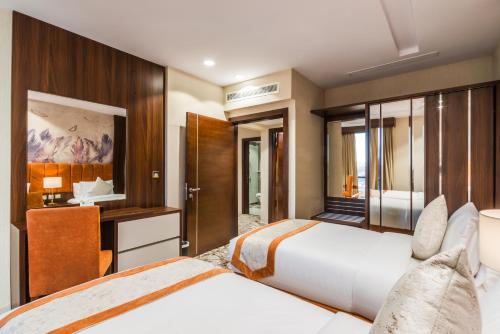 Katil atau katil-katil dalam bilik di Tulip Plaza Hotel