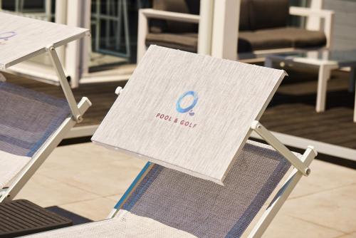 a sign sitting on top of two chairs at Hotel Quadrifoglio in Pontecagnano