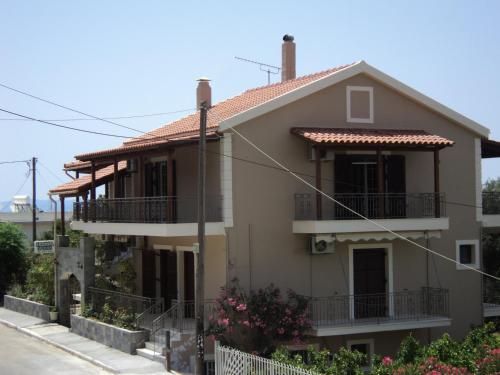 a house on the side of a street at Erminia Studios in Mousata