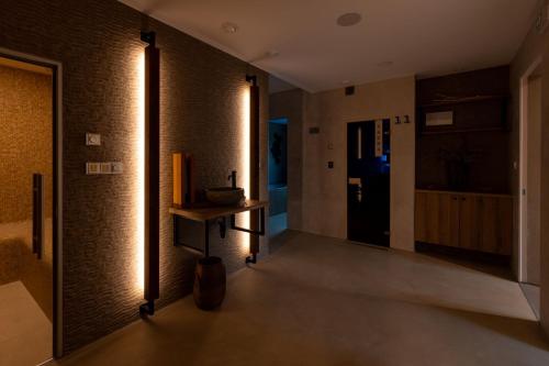 a room with a hallway with lights on the wall at Hotel Lion in Modřice