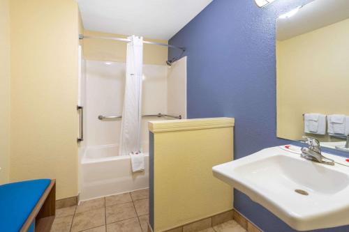 a bathroom with a sink and a toilet and a shower at Days Inn by Wyndham Alamogordo in Alamogordo