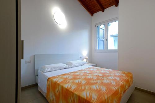 Ένα ή περισσότερα κρεβάτια σε δωμάτιο στο I Tre Moschettieri Camping Village