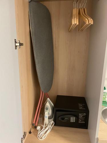 a small kitchen with a stove and a microwave at Wilanów Residence Apartments in Warsaw