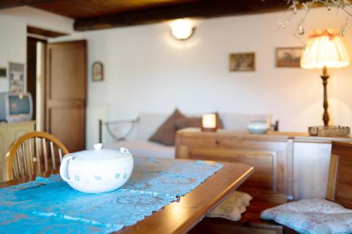 a wooden table with a bowl on top of it at Antico Granaio in Vessalico