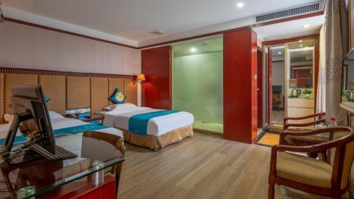 Postel nebo postele na pokoji v ubytování Suoxing Hotel Yijing Yangchun Donghu West Road