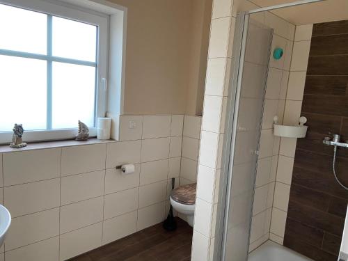 Ένα μπάνιο στο Ferienwohnung Zum Herold I