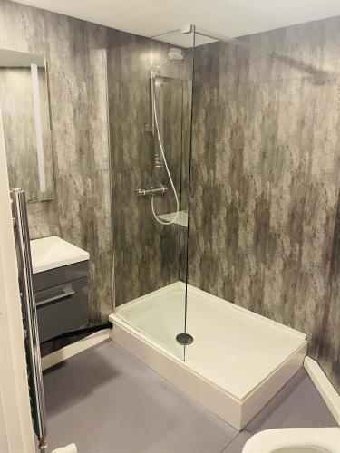 a bathroom with a shower and a sink at Hotel Express Newcastle Gateshead in Newcastle upon Tyne