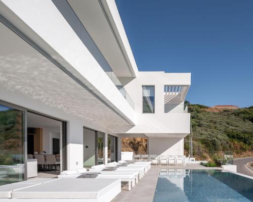 an external view of a house with a pool at Ode Iconic Residence, forever in blue, By ThinkVilla in Balíon