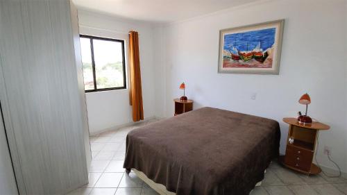 A bed or beds in a room at 1021 - Cobertura em Bombinhas com Vista para o Mar