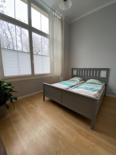 מיטה או מיטות בחדר ב-Apartamenty Sobieski