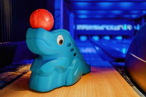 a toy elephant with an apple on its back at Hotel Młyn Aqua Spa in Elblag