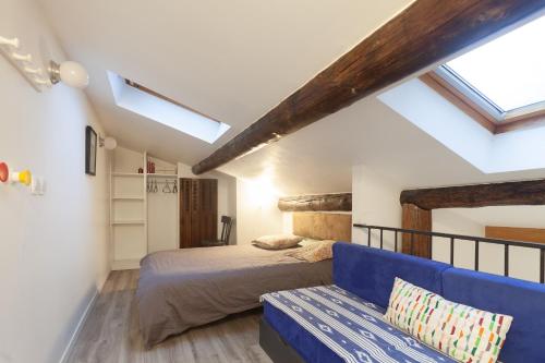 A bed or beds in a room at Appartement avec terrasse