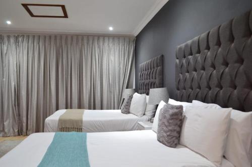 Ένα ή περισσότερα κρεβάτια σε δωμάτιο στο Honolulu Lifestyle Guest Lodge