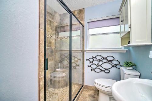 a bathroom with a shower and a toilet at Cape Royale Cottage with Fire Pit and Water Views in Coldspring