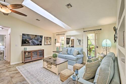 a living room with a couch and a table at Canal Waterfront Home with Private Pool and Dock! in Punta Gorda