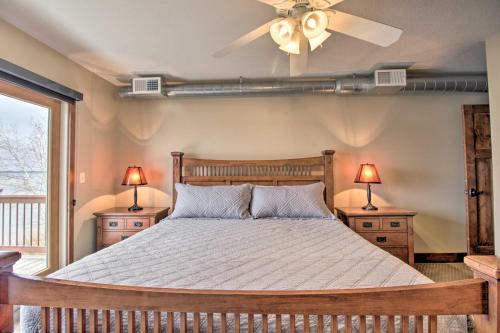 a bedroom with a bed with two night stands and two lamps at Pelican Lake Retreat with Fire Pit, Dock and Grill! in Breezy Point