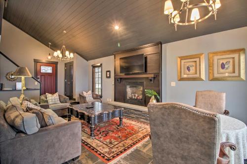 a living room filled with furniture and a fireplace at Breezy Point Escape with Views, Dock and Fire Pit! in Breezy Point