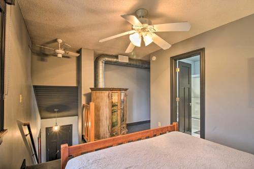 a bedroom with a ceiling fan and a bed at Breezy Point Escape with Views, Dock and Fire Pit! in Breezy Point