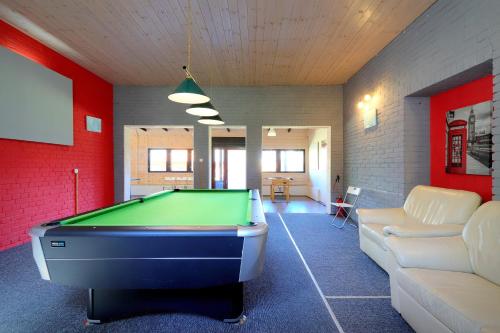 a billiard room with a pool table in it at Ośrodek Wczasowy Łowiczanka in Wisełka