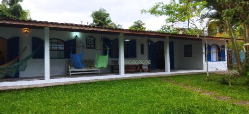 a house with a patio and a yard at Juquehy Brothers House in Juquei