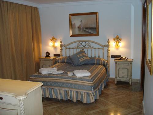 Lova arba lovos apgyvendinimo įstaigoje Hotel Hacienda Don Manuel