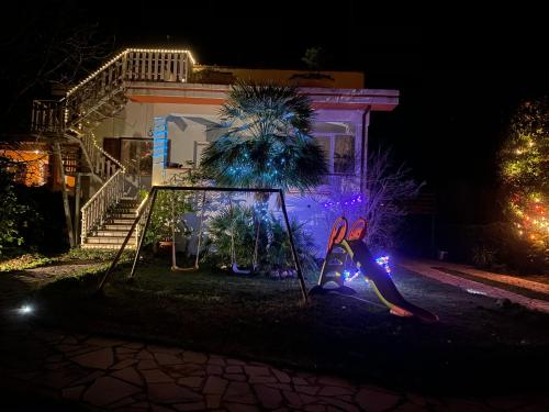 a house with christmas lights in the yard at Villa Ulivi in Tocco da Casauria