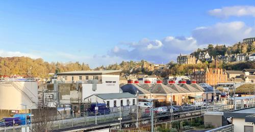 a view of a city with a train station at Pier View Apartment in Oban