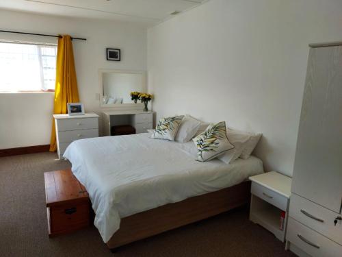 Ένα ή περισσότερα κρεβάτια σε δωμάτιο στο Rose Cottage