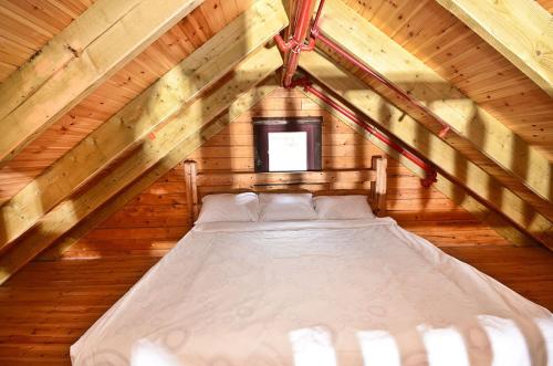 Postel nebo postele na pokoji v ubytování Yagorov Chalet