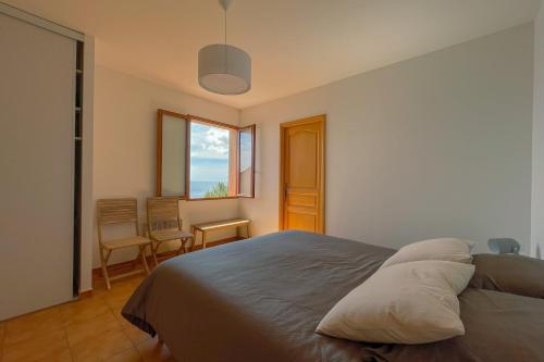 Ένα ή περισσότερα κρεβάτια σε δωμάτιο στο Family villa with Unique Sea view for 11people