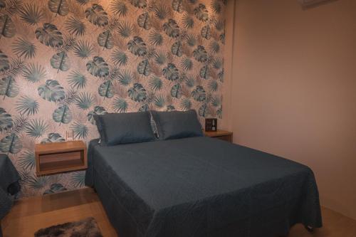 Ένα ή περισσότερα κρεβάτια σε δωμάτιο στο Loft dos Canyons