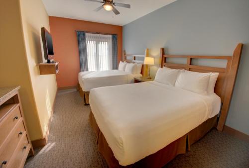 a hotel room with two beds and a television at Spirit Ridge, in The Unbound Collection by Hyatt in Osoyoos