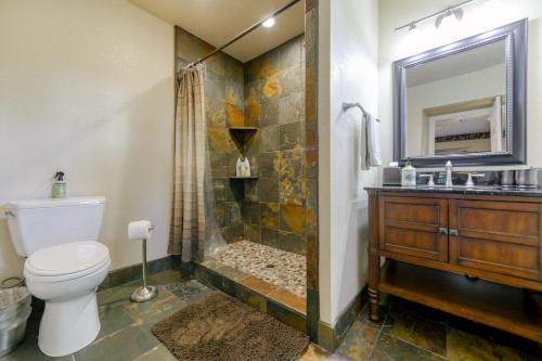a bathroom with a toilet and a shower and a sink at Hope Inn Redding in Redding